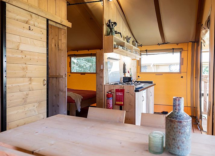 Enjoy yourself on the terrace of De Bos Tent, an attractive glamping lodge in Huizen, IJsselmeer coast, North Holland, with a cozy outdoor area.