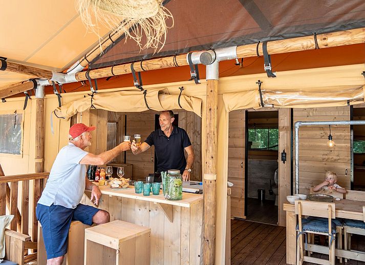 Enjoy the peace and quiet at De Heide Tent in Huizen, North Holland. This glamping lodge offers a cozy porch surrounded by nature.
