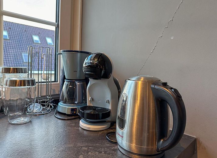 Gemuetliche Sitzecke im Ferienhaus Wadden House, Westerland, mit stilvoller Einrichtung und warmen Farben.