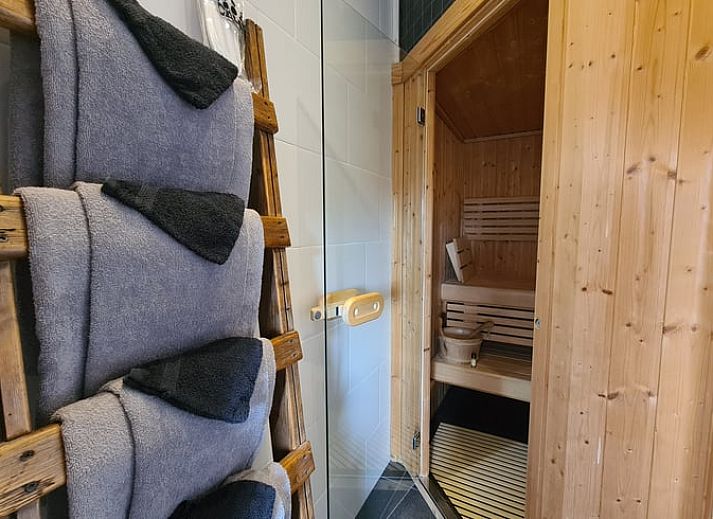 Dining area with stairs in Holiday home in Oudesluis, North Holland, perfect for family dinners.