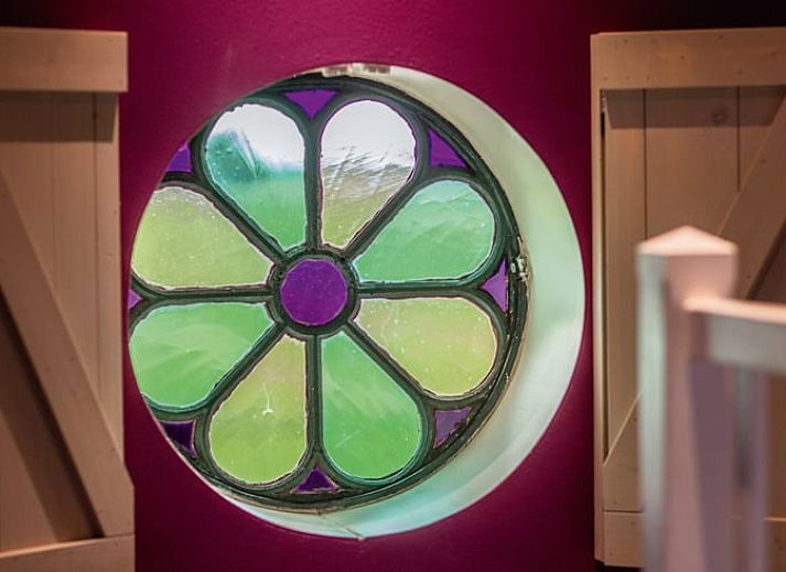 Dining area with stairs in Holiday home in Oudesluis, North Holland, perfect for family dinners.