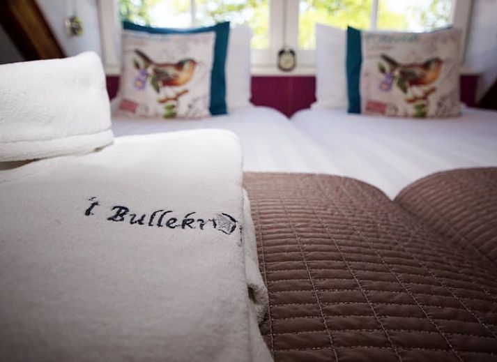 Dining area with stairs in Holiday home in Oudesluis, North Holland, perfect for family dinners.