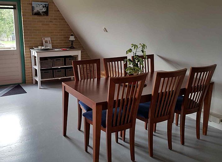 Comfortable bedroom in NH351 vacation home in 't Zand, North Holland with large window.