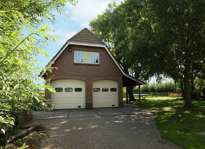 Comfortable bedroom in NH351 vacation home in 't Zand, North Holland with large window.