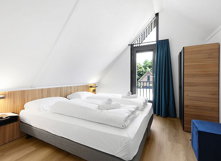 Stijlvolle slaaphoek met bergruimte in Berger Duinen vakantiehuis, Schoorl.