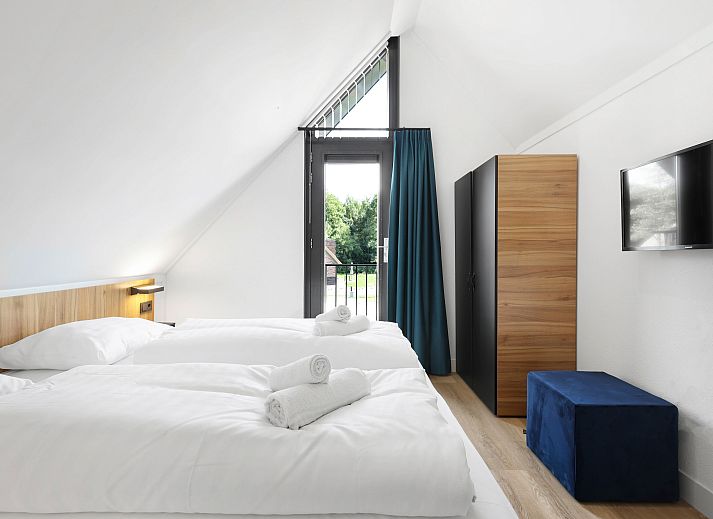 Stijlvolle slaaphoek met bergruimte in Berger Duinen vakantiehuis, Schoorl.