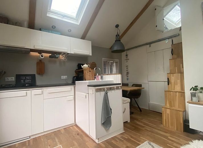 Enjoy the peace and quiet at Huisje in Schoorl, a charming vacation home in North Holland with a sunny terrace surrounded by nature.