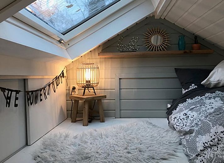 Enjoy the peace and quiet at Huisje in Schoorl, a charming vacation home in North Holland, surrounded by greenery and a sunny terrace.