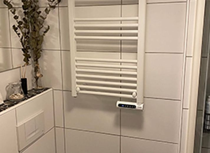 Enjoy the peace and quiet at Huisje in Schoorl, a charming vacation home in North Holland, surrounded by greenery and a sunny terrace.