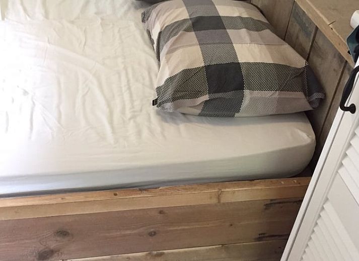 Cozy living room in a cottage in Schoorl, North Holland. Vacation home with bright interior and modern furnishings surrounded by nature.