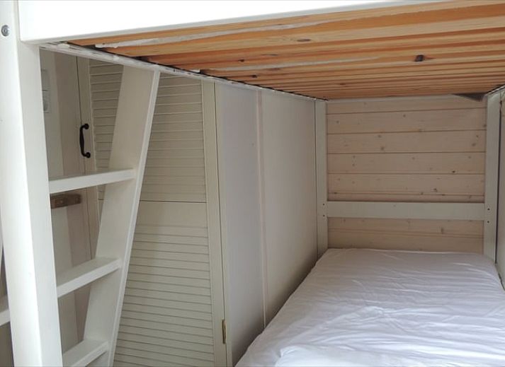 Cozy living room in a cottage in Schoorl, North Holland. Vacation home with bright interior and modern furnishings surrounded by nature.