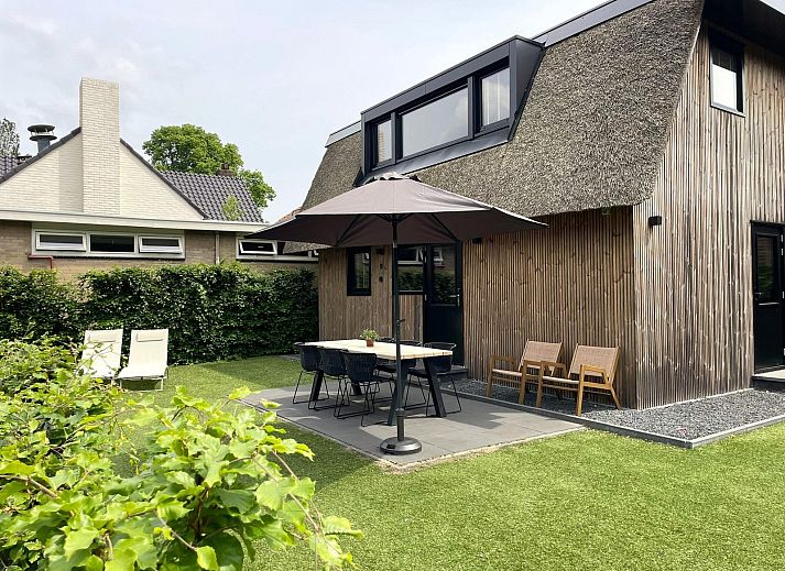 6-person Dune Lodge in Schoorl, North Holland with sunny terrace and green surroundings.