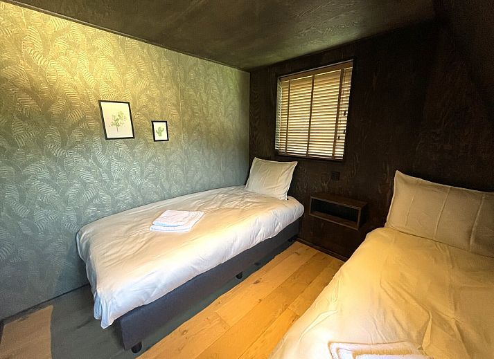 Cozy terrace at 6-person Dune Lodge in Schoorl, surrounded by nature.