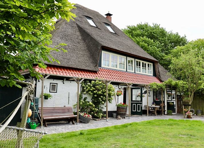 Enjoy the sunny terrace at Vakantiehuis in Schoorl, a charming vacation home in the green surroundings of North Holland North.
