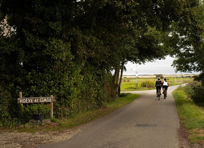 Cozy kitchen in vacation home in Schoorl, North Holland, with vintage stove and cookware, ideal for culinary adventures.