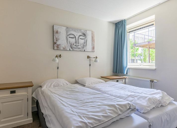 Cozy living room of vacation home Assum Great in Uitgeest, North Holland, with comfortable interior and terrace view.