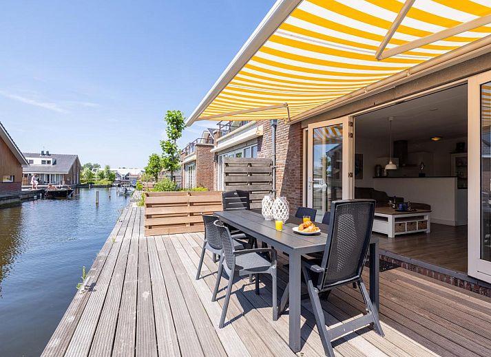 Apartment Assum I in Uitgeest, North Holland offers a beautiful view of the water from this modern vacation home.