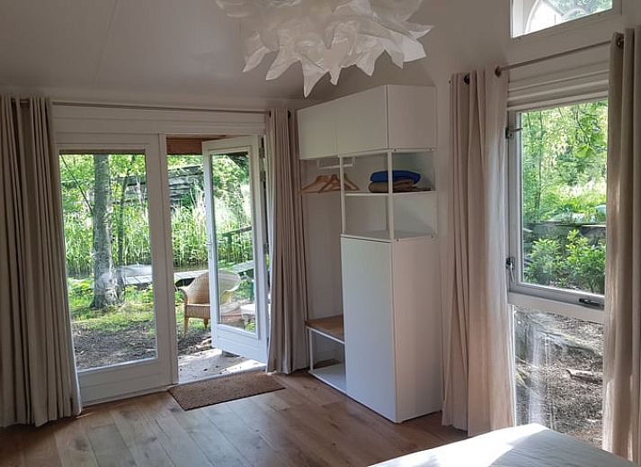 Cozy interior of Cottage in Kortenhoef, North Holland, with French doors.