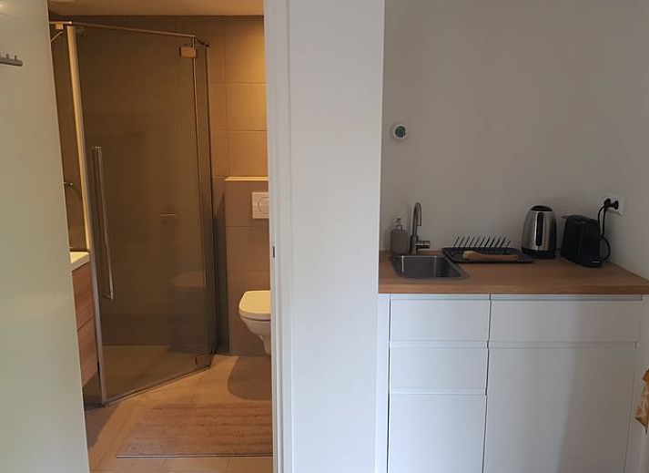 Cozy interior of Cottage in Kortenhoef, North Holland, with French doors.