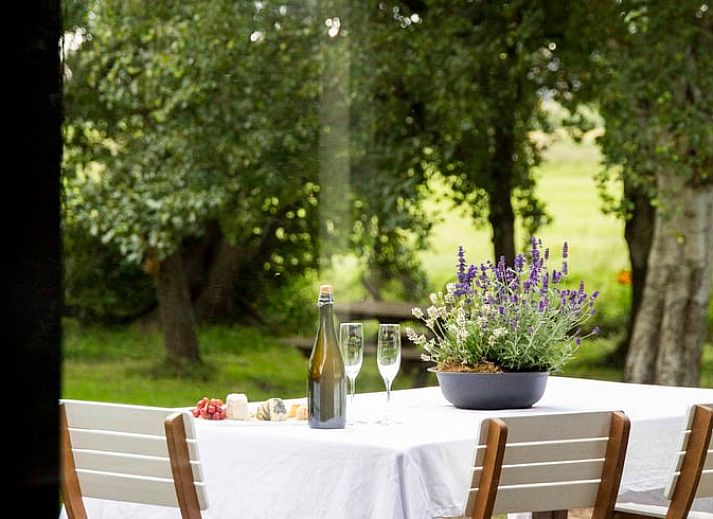 Gemuetliches Wohnzimmer im Ferienhaus in Amsterdam, perfekt fuer einen entspannten Aufenthalt in Amsterdam eo.