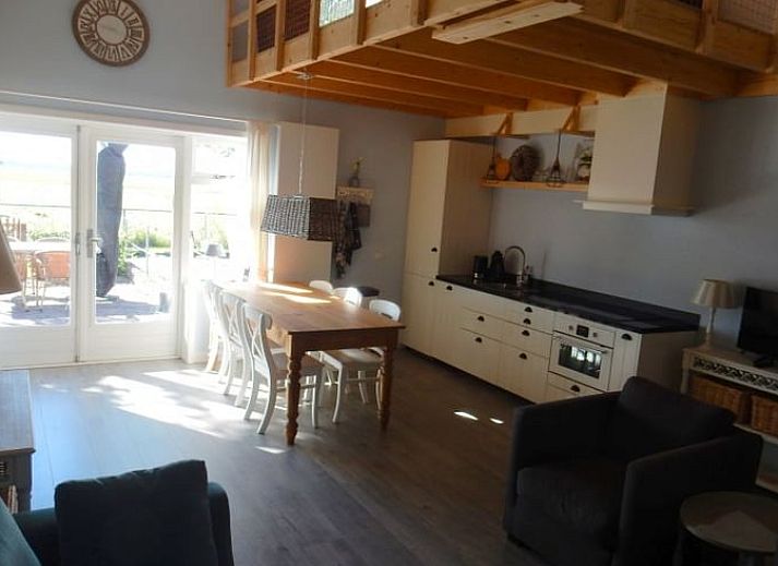 Stylish living room of Holiday Home in Weesp, Amsterdam eo, North Holland with comfortable seating area and plenty of natural light.