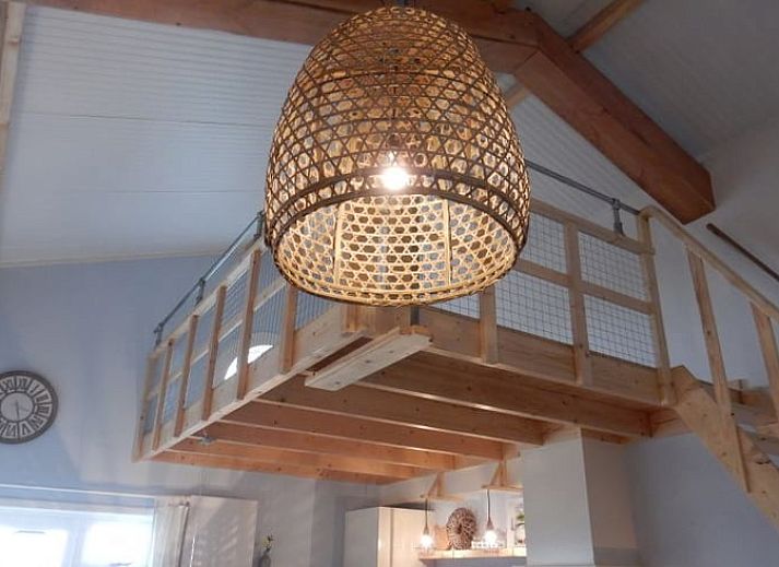 Stylish living room of Holiday Home in Weesp, Amsterdam eo, North Holland with comfortable seating area and plenty of natural light.