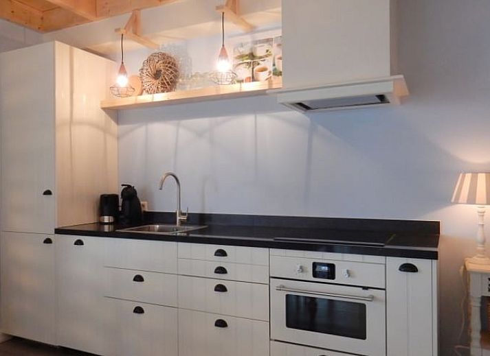 Stylish living room of Holiday Home in Weesp, Amsterdam eo, North Holland with comfortable seating area and plenty of natural light.
