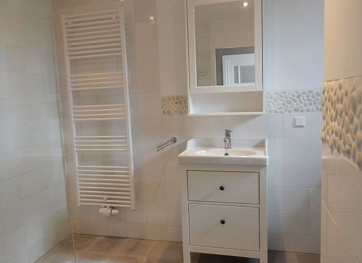 Stylish living room of Holiday Home in Weesp, Amsterdam eo, North Holland with comfortable seating area and plenty of natural light.