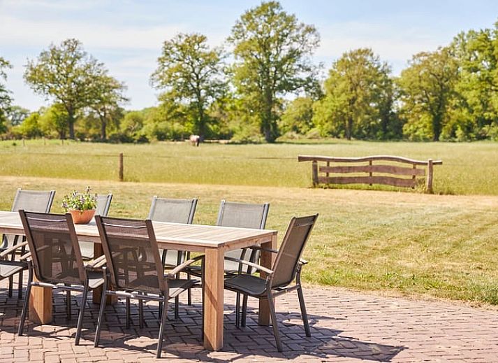 Cozy dining area in Cottage in Mander, vacation accommodation in Twente.