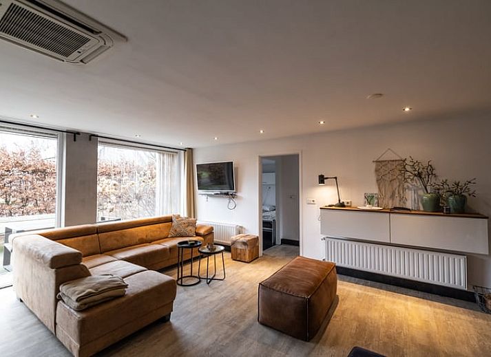 Cozy indoor area of cottage in Den Ham, Twente. Comfortable sitting area with views of nature in Overijssel.
