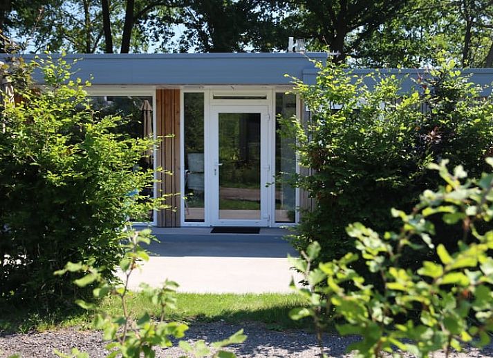 Cozy living room in Holiday Home in Den Ham, Twente, with comfortable seating area and views of the nature of Overijssel.