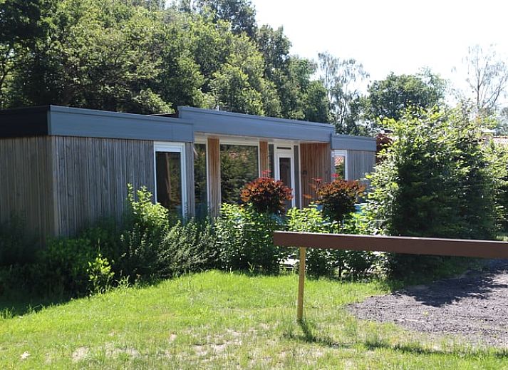 Cozy living room in Holiday Home in Den Ham, Twente, with comfortable seating area and views of the nature of Overijssel.