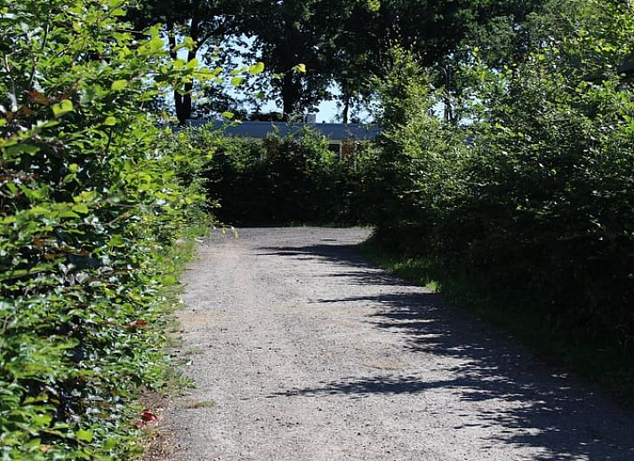 Cozy living room in Holiday Home in Den Ham, Twente, with comfortable seating area and views of the nature of Overijssel.