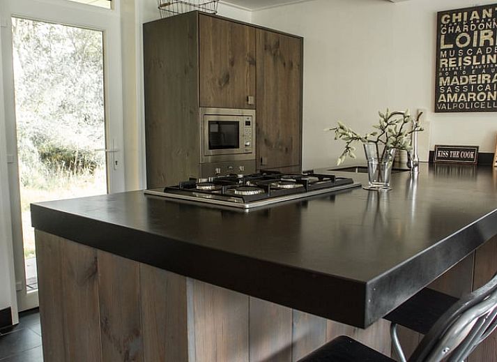 Cozy living room of cottage in Den Ham, Twente, with modern furnishings and comfortable seating area in Overijssel.
