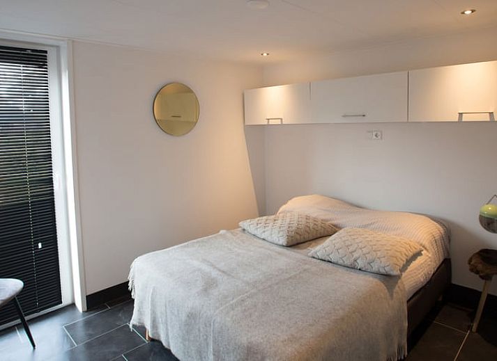 Cozy living room of cottage in Den Ham, Twente, with modern furnishings and comfortable seating area in Overijssel.