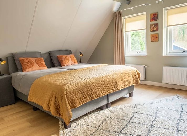 Rustig terras bij Vakantiehuisje in Den Ham, Twente, ideaal voor ontspannen in de buitenlucht.