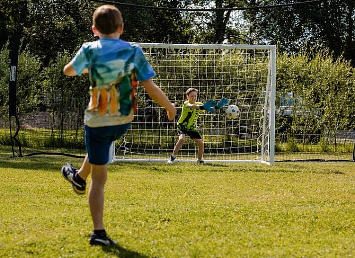 Cozy bedroom in Cottage in Den Ham, Twente, Overijssel with atmospheric lighting and comfortable beds.