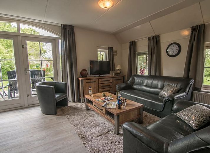 Charming vacation home in Den Ham, Twente, Overijssel, surrounded by autumn trees and rustic nature, ideal for a relaxing stay.