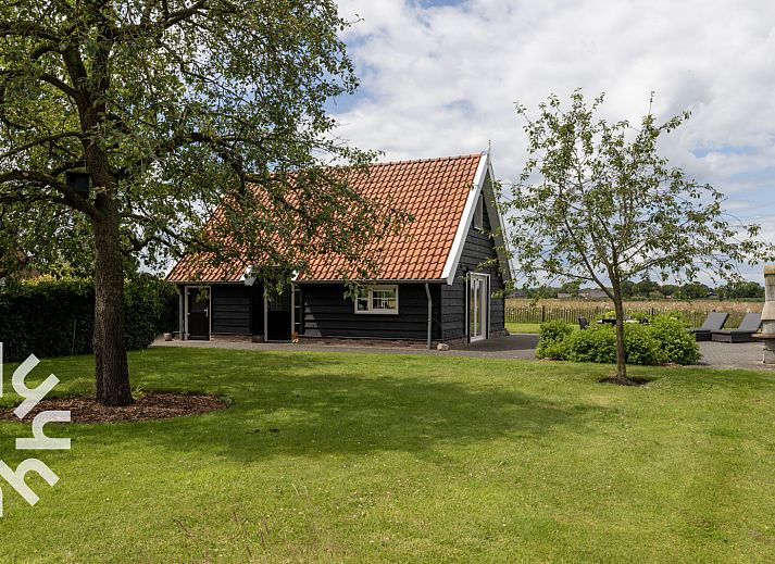 Vakantiehuis OV404 in Den Ham, Twente omringd door groene natuur en rustieke charme.