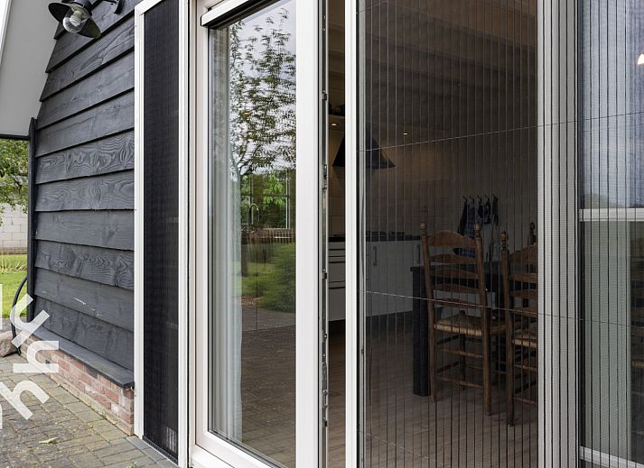 Vakantiehuis OV404 in Den Ham, Twente omringd door groene natuur en rustieke charme.