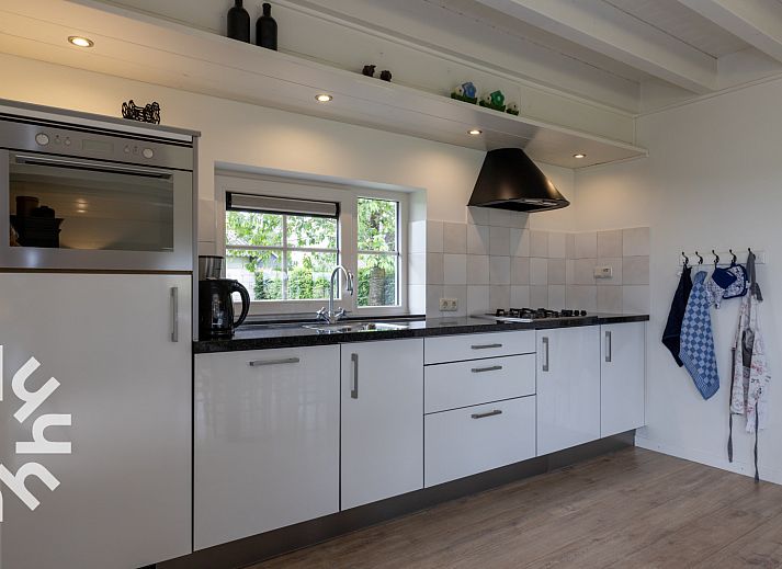 Terras van vakantiehuis OV404 in Den Ham, Twente met toegang tot de eetkamer.