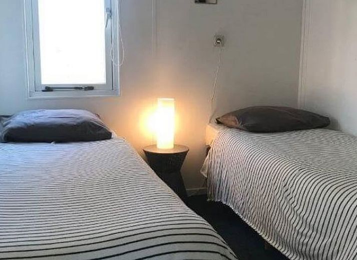 Gezellige eetkamer in Vakantiehuis in Den Ham, Twente, Overijssel, met ruime tafel en comfortabele stoelen voor een ontspannen verblijf.