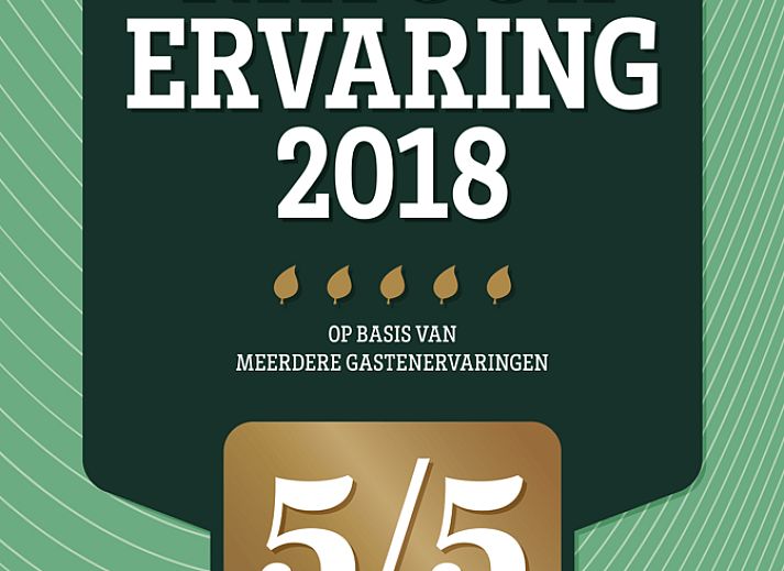 Gezellige woonkamer van Vakantiehuis in Den Ham, Twente, met comfortabele zitruimte en compleet ingerichte keuken in Overijssel.