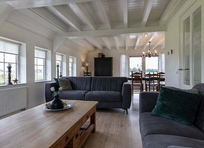 Het Assenhoekje, ein gemuetliches Ferienhaus in Den Ham, Twente, bietet eine herrliche Aussicht auf die gruene Landschaft von Overijssel.