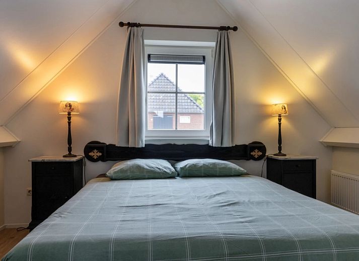 Geniessen Sie die Ruhe und den Frieden im Assenhoekje in Den Ham, Twente. Entspannen Sie sich auf der Terrasse dieses Ferienhauses mit Blick auf gruene Felder.