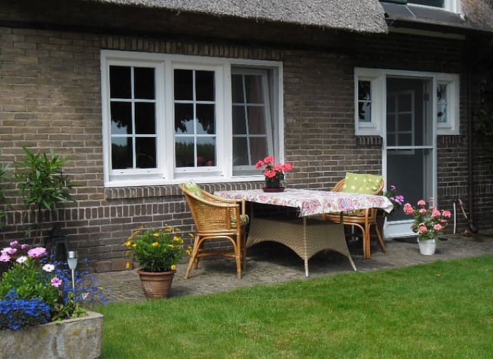Cozy porch of Cottage in De Lutte, Twente, Overijssel, with comfortable chairs and country charm.