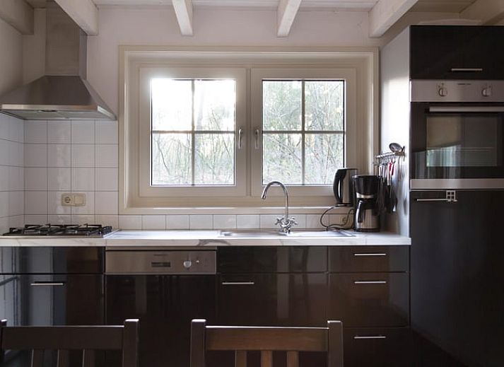 Vacation home in de Lutte, Twente with terrace and picnic table surrounded by nature in Overijssel.