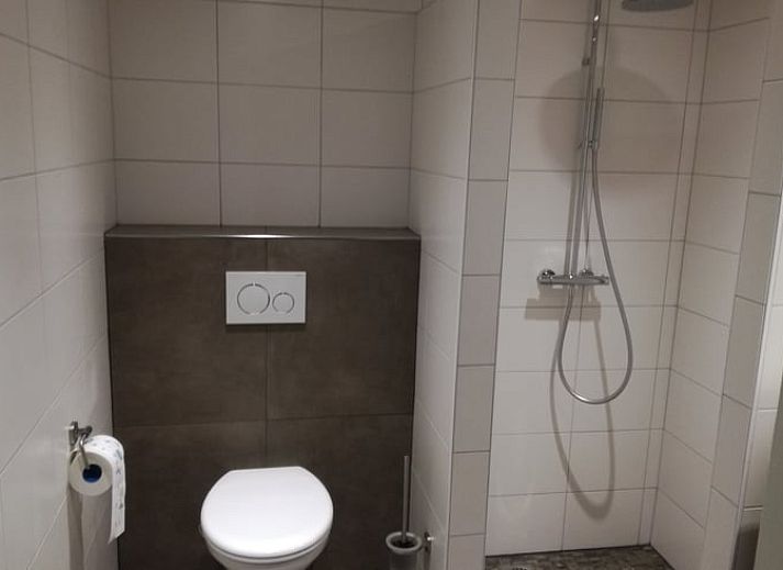 Gezellige woonkamer van Huisje in Ootmarsum, vakantieverblijf in Twente, met moderne voorzieningen.