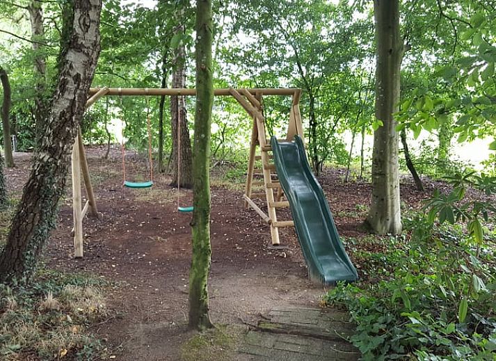 Cozy wood stove in vacation home Hezingen, Twente, for warm evenings.