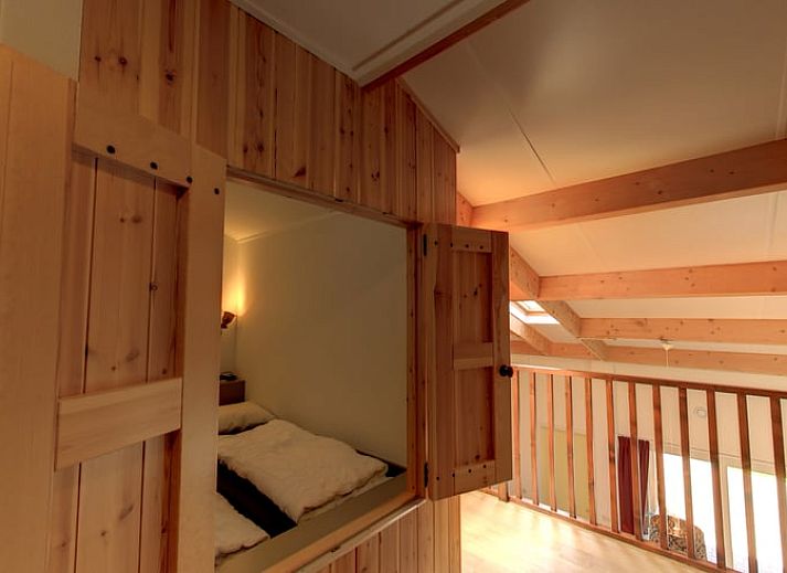 Veranda van vakantiehuisje in Hezingen met uitzicht op groene omgeving in Twente, Overijssel.